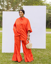 Load image into Gallery viewer, PRODUCT DESCRIPTION  2-piece co-ord set Button down shirt Bishop collar Front pocket detail on top Midi bell sleeve with frills Ruffle trim wide leg pants Side pockets Colour - Orange
