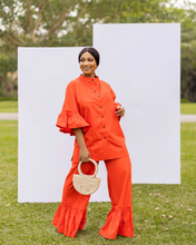 Load image into Gallery viewer, PRODUCT DESCRIPTION  2-piece co-ord set Button down shirt Bishop collar Front pocket detail on top Midi bell sleeve with frills Ruffle trim wide leg pants Side pockets Colour - Orange
