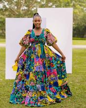 Load image into Gallery viewer, Hand crafted Deep V neckline Deep back cut-out with tie detail Cinched waistline Fitted bodice Full elasticized bell sleeves 2-tier gathered base Patchwork Maxi dress Side Pockets African print (Ankara)

