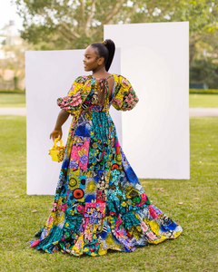 Hand crafted Deep V neckline Deep back cut-out with tie detail Cinched waistline Fitted bodice Full elasticized bell sleeves 2-tier gathered base Patchwork Maxi dress Side Pockets African print (Ankara)