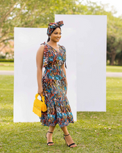 Load image into Gallery viewer, Hand crafted Sleeveless Deep V neckline on both sides Cinched waistline Shoulder bows Single-tier gathered skirt-base Back zipper Full cotton lined bodice Midi dress Side Pockets African print (Ankara)

