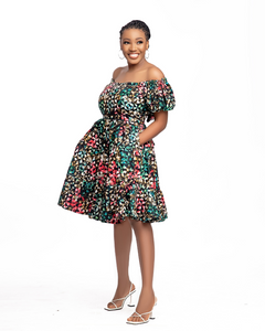 Heba is an off-shoulder African print (Ankara) mini dress with an elasticized puffed sleeve, a fitted bodice, tie-back details, and two-step gathers. Of course, like most FA dresses, she comes with pockets.  The model is wearing a size 12.