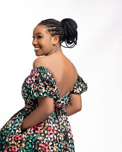 Heba is an off-shoulder African print (Ankara) mini dress with an elasticized puffed sleeve, a fitted bodice, tie-back details, and two-step gathers. Of course, like most FA dresses, she comes with pockets.  The model is wearing a size 12.