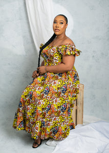African print midi dress with shirred back detail and side pockets.  The model is wearing a size 18.